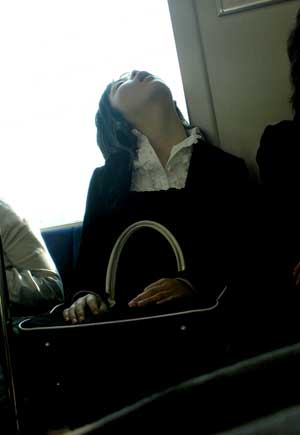 A lady sleeping on the train in Japan